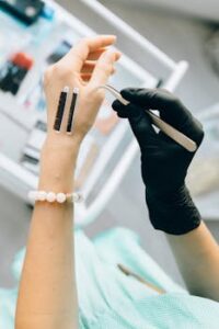 Close-up of a professional applying eyelash extensions in a beauty salon setting.