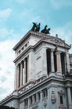 Majestic view of Altare della Patria in Rome, highlighting classical architecture and historic sculptures.